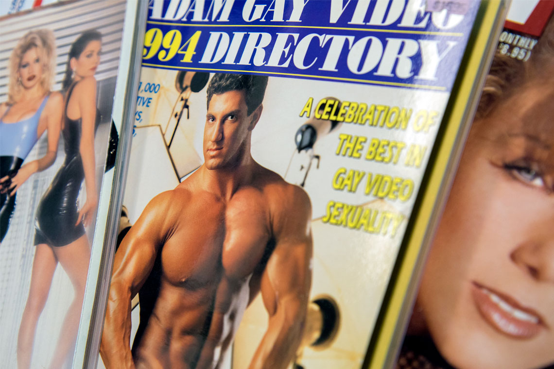 Photograph of Cover of Adam Gay Video 1994 Directory showing muscular Caucasian man.